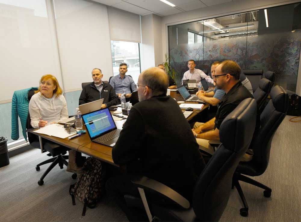 A diverse group of professionals collaborating at a conference table.