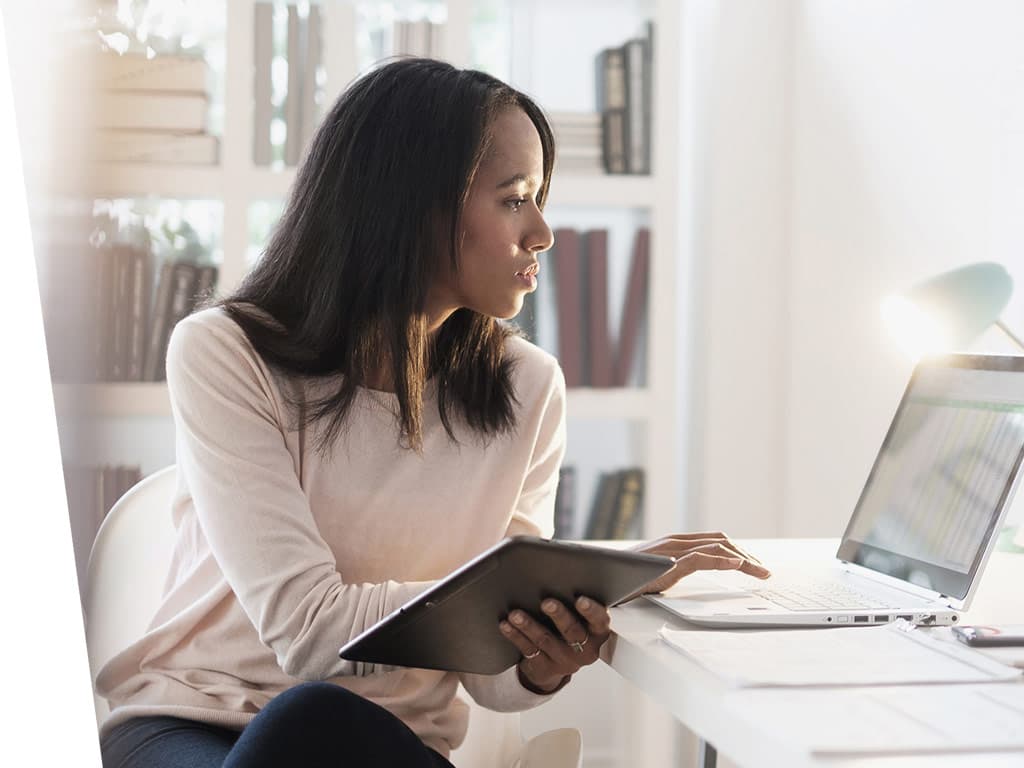 Women working from home with laptop.