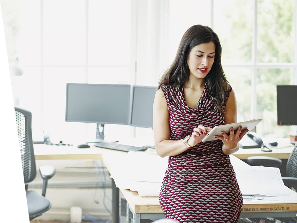 Women working in her office with iPad.